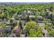 An aerial view of the property and neighborhood with mature trees and landscaping at 386 Colorado Blvd, Denver, CO 80206