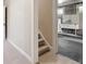 Stairway leading to the unfinished basement which has concrete floors and access to a utility sink at 386 Colorado Blvd, Denver, CO 80206