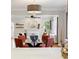 Open concept living space showcasing dining area leading to a bright living room with fireplace at 386 Colorado Blvd, Denver, CO 80206