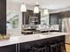 Bright, modern kitchen with stainless steel appliances, a breakfast bar and stylish pendant lighting at 386 Colorado Blvd, Denver, CO 80206