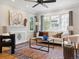 Bright living space featuring hardwood floors, fireplace, and plenty of natural light at 386 Colorado Blvd, Denver, CO 80206