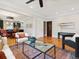 Open living area with hardwood floors, neutral colors, and adjacent dining space at 386 Colorado Blvd, Denver, CO 80206