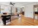 Spacious living room with hardwood floors, large windows, and elegant furnishings at 386 Colorado Blvd, Denver, CO 80206