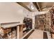 Basement wine cellar and storage room with multiple racks filled with wine bottles. The space also has some boxes at 386 Colorado Blvd, Denver, CO 80206