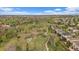 This is an aerial view of the neighborhood featuring houses, green spaces and walking trails at 7829 S Coolidge Way, Aurora, CO 80016