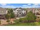 This is an aerial view of the back of the home, highlighting the yard, patio, and landscaping at 7829 S Coolidge Way, Aurora, CO 80016