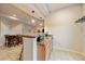 Inviting bar featuring stylish seating and a sleek kitchenette, seamlessly blending functionality with modern design at 7829 S Coolidge Way, Aurora, CO 80016