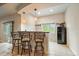 Stylish bar with pendant lighting and seating, perfect for entertaining guests with backyard views at 7829 S Coolidge Way, Aurora, CO 80016
