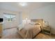 Cozy bedroom features neutral walls, carpet, and a large window at 7829 S Coolidge Way, Aurora, CO 80016