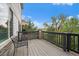 This outdoor deck area is furnished with chairs and offers views of the surrounding landscape at 7829 S Coolidge Way, Aurora, CO 80016