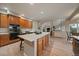 Open kitchen with a large island and connection to the living spaces at 7829 S Coolidge Way, Aurora, CO 80016