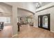 Bright and airy living room with soaring ceilings, a large front door, and ample natural light at 7829 S Coolidge Way, Aurora, CO 80016