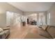 Spacious living area that flows seamlessly into the dining area, with hardwood floors and neutral decor at 7829 S Coolidge Way, Aurora, CO 80016