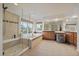 Large main bathroom includes a glass enclosed shower and a soaking tub by a window at 7829 S Coolidge Way, Aurora, CO 80016