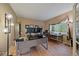 Spacious home office with plenty of natural light and dedicated work spaces at 7829 S Coolidge Way, Aurora, CO 80016