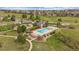 This is an aerial view of the community pool area, including the pool, clubhouse, and playground at 7829 S Coolidge Way, Aurora, CO 80016