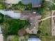 Aerial view of the property showcasing a sprawling backyard, stone patio, and detached garage at 3811 E 26Th Avenue Pkwy, Denver, CO 80205
