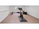 Basement gym with stationary bike, bench and mats, providing a dedicated fitness space at 3811 E 26Th Avenue Pkwy, Denver, CO 80205