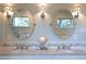 Elegant bathroom featuring double sinks, marble countertops, and decorative tiling at 3811 E 26Th Avenue Pkwy, Denver, CO 80205
