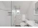 Modern bathroom featuring a glass shower, a toilet, and a sink, all with a clean design at 3811 E 26Th Avenue Pkwy, Denver, CO 80205