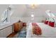 Charming bedroom with vaulted ceiling, dormer window, and eclectic decor creating a cozy atmosphere at 3811 E 26Th Avenue Pkwy, Denver, CO 80205