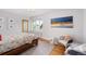 Cozy bedroom featuring a comfortable bed, a chair, and a window for plenty of natural light at 3811 E 26Th Avenue Pkwy, Denver, CO 80205