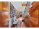 Inviting foyer with wood staircase, stylish wall art, and a view of the front entrance at 3811 E 26Th Avenue Pkwy, Denver, CO 80205