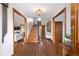 Elegant foyer with hardwood floors, staircase, and decorative accents creating a welcoming entrance at 3811 E 26Th Avenue Pkwy, Denver, CO 80205