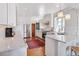 Bright kitchen features marble countertops, stainless steel appliances, and classic white cabinetry at 3811 E 26Th Avenue Pkwy, Denver, CO 80205