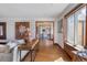 Spacious living area with hardwood floors, elegant decor, and a view into the dining area at 3811 E 26Th Avenue Pkwy, Denver, CO 80205
