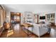 Bright living room featuring hardwood floors, a fireplace, and comfortable seating, perfect for relaxation at 3811 E 26Th Avenue Pkwy, Denver, CO 80205