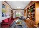 Spacious living room featuring built-in shelving, a window seat, and stylish decor at 3811 E 26Th Avenue Pkwy, Denver, CO 80205