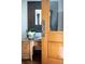 Charming office nook featuring a wooden desk, decorative mirror, and a touch of greenery for a cozy workspace at 3811 E 26Th Avenue Pkwy, Denver, CO 80205
