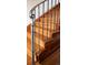 Detailed staircase showcasing the craftsmanship of wood steps and wrought iron railings at 3811 E 26Th Avenue Pkwy, Denver, CO 80205