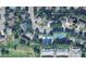 Aerial view of a neighborhood with a community pool, park, and single Gathering homes at 7629 S Fillmore Way, Centennial, CO 80122