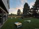 Spacious backyard perfect for outdoor activities, featuring a fire pit, a patio, and mature trees at 7629 S Fillmore Way, Centennial, CO 80122