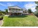 Expansive backyard with a well-maintained lawn, covered patio, and deck, perfect for outdoor enjoyment at 7629 S Fillmore Way, Centennial, CO 80122