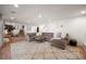 Spacious finished basement with a large sectional sofa, plush rug, and a cozy atmosphere, perfect for relaxation at 7629 S Fillmore Way, Centennial, CO 80122