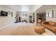 Finished basement featuring a stone fireplace, workout area, and living space at 7629 S Fillmore Way, Centennial, CO 80122