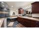 Modern bathroom with a stone shower, soaking tub, and dark wood vanity at 7629 S Fillmore Way, Centennial, CO 80122