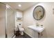 Classic bathroom with a pedestal sink, walk-in shower, and slate floors, designed for both functionality and style at 7629 S Fillmore Way, Centennial, CO 80122