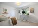 Bright bedroom featuring a window desk, soft carpet, and decorative shelving at 7629 S Fillmore Way, Centennial, CO 80122