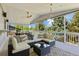 Relax on this stylish deck featuring comfortable seating and a coffee table, perfect for enjoying the outdoors at 7629 S Fillmore Way, Centennial, CO 80122