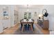 Elegant dining room with a large table, seating for eight, and built-in cabinets creates a perfect space at 7629 S Fillmore Way, Centennial, CO 80122