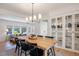 Charming dining room next to a spacious living area with hardwood floors and ample natural light at 7629 S Fillmore Way, Centennial, CO 80122