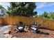 Inviting backyard fire pit area with seating, ideal for cozy evenings and outdoor gatherings at 7629 S Fillmore Way, Centennial, CO 80122