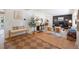 Cozy living room featuring hardwood floors, fireplace, seating area, and stylish decorations provides a relaxing atmosphere at 7629 S Fillmore Way, Centennial, CO 80122