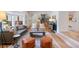 Spacious living room with comfortable seating, stylish rug, and large windows offers ample natural light at 7629 S Fillmore Way, Centennial, CO 80122