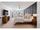 Spacious main bedroom with a wood accent wall, plush carpet, and natural light at 7629 S Fillmore Way, Centennial, CO 80122