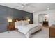 Spacious main bedroom with natural light, ceiling fan, and en suite bath access at 7629 S Fillmore Way, Centennial, CO 80122